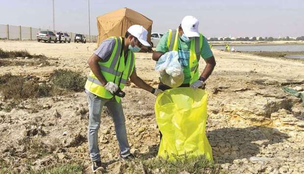 Doha Bank employees take part in beach clean-up