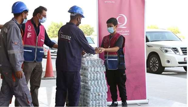 Qatar Charity joins hands with local initiative to distribute water to workers