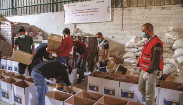 QRCS, Qatar Airways distribute food baskets in Jordan and Gaza